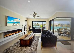 a living room with a couch and a fireplace at Bella Vista Bed and Breakfast of Raby Bay in Cleveland