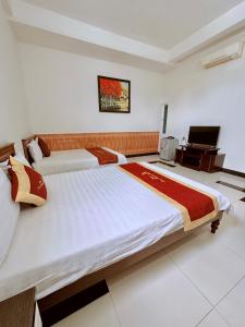 Voodi või voodid majutusasutuse Trúc Hoàng Hà Hotel toas