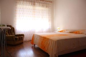 Posteľ alebo postele v izbe v ubytovaní Apartment Sendy + 37 fotografií