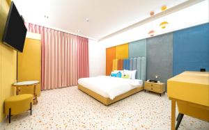 Postel nebo postele na pokoji v ubytování Jangyu Almond Kids Hotel