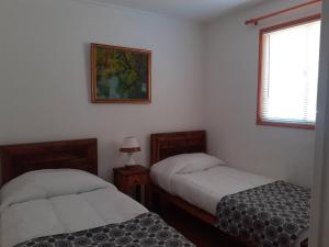 เตียงในห้องที่ Room in Lodge - Valparaluz House, 2 People, Private Bathroom no1641