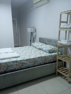 a bed in a room with a ladder next to it at power suit in Fethiye