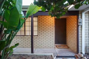a brick building with a door and a window at Luxe 3BR Villa with Kitchen & Laundry in Perth