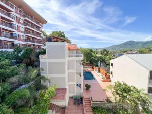 an apartment with a view of a building at Tri's Miracle Kata Beach Side in Kata Beach