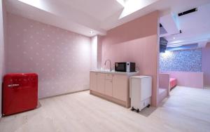 Kuchyň nebo kuchyňský kout v ubytování Jangyu Almond Kids Hotel