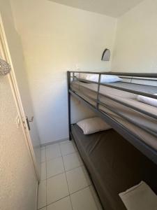 Ένα ή περισσότερα κρεβάτια σε δωμάτιο στο Appartement 211 Les Salicornes