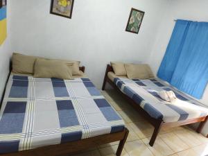 Postel nebo postele na pokoji v ubytování Hadefe Cottages