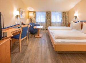 Postel nebo postele na pokoji v ubytování Hotel Neuwirt