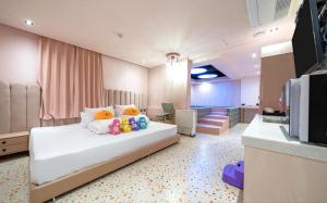 Postel nebo postele na pokoji v ubytování Jangyu Almond Kids Hotel + 37 fotografií