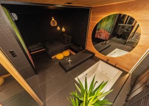 an overhead view of a bathroom with a mirror and a sink at Eclipse Gold Room in Bielsko-Biała