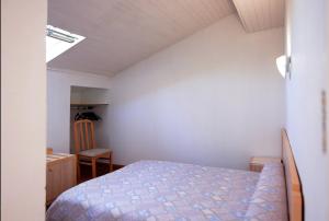 Ένα ή περισσότερα κρεβάτια σε δωμάτιο στο Hôtel De Porticcio