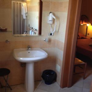 a bathroom with a sink and a mirror at B&B Villa Eben Ezer in Avola