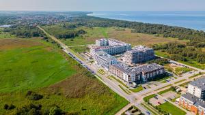 an aerial view of a building in a field at Blue&Green Baltic Hotel mediSPA&fit in Kołobrzeg