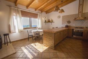 a kitchen with a table and a counter top at Catalunya Casas Indoor and Outdoor Pools, Sauna, Gym, Games Area in Sant Pau dʼOrdal