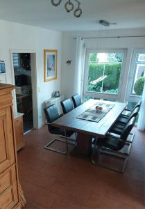 a dining room with a table and chairs at Haus auf der Schwäbischen Alb in Grabenstetten