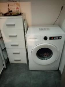 a washer and dryer in a small room at Apartment by the Sea,Neoi Epivates Beach, Thessaloniki in Neoi Epivates