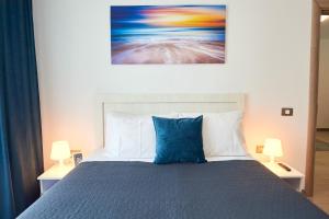 En eller flere senge i et værelse på Apartament Rise and Shine 1 by Alz