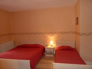 Postel nebo postele na pokoji v ubytování Hotel Le Beauregard
