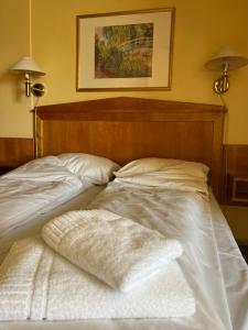 a bed with two white pillows on top of it at Øvre Sem Gård in Asker