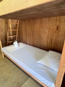 a bunk bed in a room with a ladder at Cabanas Pacifico Siargao Tourist Inn in San Isidro