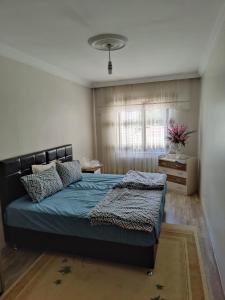 Postel nebo postele na pokoji v ubytování Onur apartman