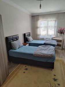 Postel nebo postele na pokoji v ubytování Onur apartman