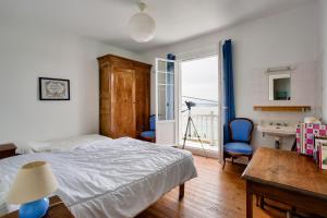 En eller flere senge i et værelse på Maison familale au panorama de rêve