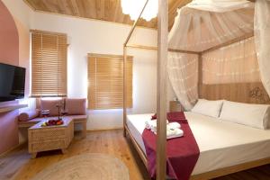 A bed or beds in a room at The Little Prince Boutique Otel