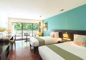 Postel nebo postele na pokoji v ubytování The Regent Cha Am Beach Resort, Hua Hin