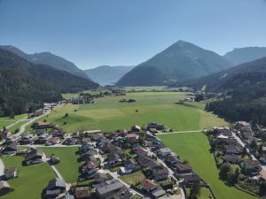 an aerial view of a village with mountains in the background at Appartement Lisi`s Dahoam in Achenkirch
