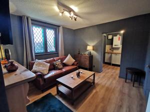 a living room with a couch and a coffee table at Manor by the Lake in Cheltenham