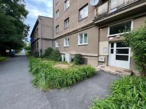 a building with tall grass in front of it at COZY apartment in GREAT location in Košice