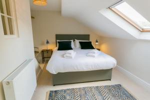 Ένα ή περισσότερα κρεβάτια σε δωμάτιο στο Ty Medi