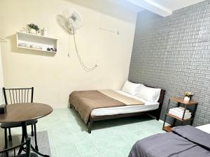 A bed or beds in a room at PD Hostel