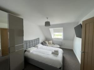 a small bedroom with a bed and a window at 4 bedroom House Boston Lincs Pet & Child friendly in Boston +60 photos