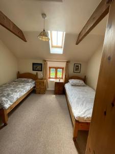 Postel nebo postele na pokoji v ubytování St Twynnells cottage