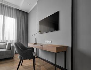 Televízia a/alebo spoločenská miestnosť v ubytovaní AC Hotel by Marriott Penang