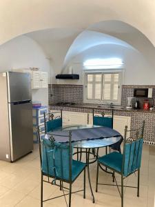 Kuchyň nebo kuchyňský kout v ubytování BUNGALOW El HOUDA