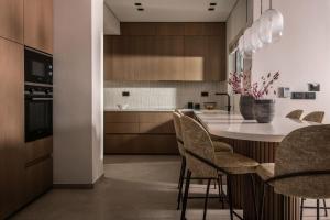 a kitchen with a table and chairs in a room at Eran Luxury Villa with Private Pool & Sea Views, by ZanteWize in Akrotiri