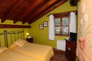 Tempat tidur dalam kamar di Hotel-Posada La Casa de Frama