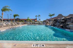 a large swimming pool at a resort at Quality Inn Kennedy Space Center in Titusville