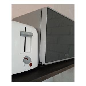a microwave oven sitting on top of a counter at The Retreat in Kommetjie