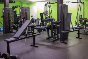 a gym with a bunch of tread machines in it at Apple Hotel & Konferens Göteborg in Gothenburg