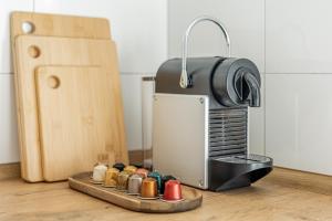 a toaster sitting on top of a counter next to a table at GT-City Suite 01 I Gasgrill I Smart-TV I Balkon in Gütersloh