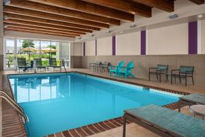 a large pool with blue water in a hotel room at Home2 Suites by Hilton - Memphis/Southaven in Southaven