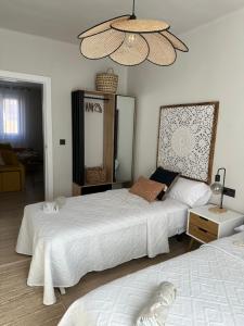 a bedroom with two beds and a dog laying on the bed at Nordic Home in Tudela