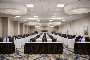 a large room with tables and chairs in it at Embassy Suites by Hilton Orlando International Drive Convention Center in Orlando +23 photos