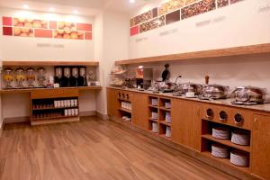 a kitchen with a counter with pots and pans at Hampton Inn by Hilton Merida in Mérida