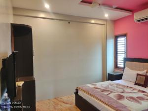 Postel nebo postele na pokoji v ubytování CAUVERY PARADISE + 3 fotografie