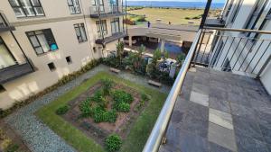 an aerial view of a garden in the middle of a building at Accommodation Front - Regal 6 Sleeper Across the Ocean in Durban